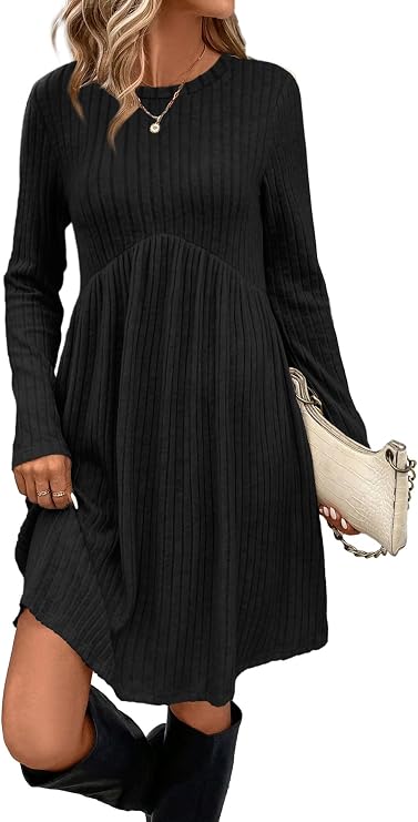 Black long-sleeve empire waist tunic dress with pockets, worn with boots
